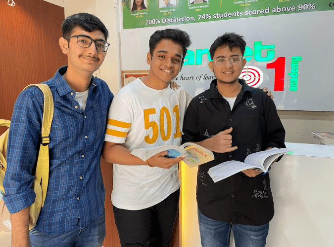 "Three students smiling and feeling cheerful while studying at Target 1 Academy in Pune."