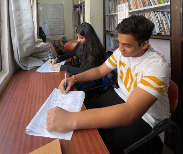 "Students studying in the classroom at Target 1 Academy in Pune."