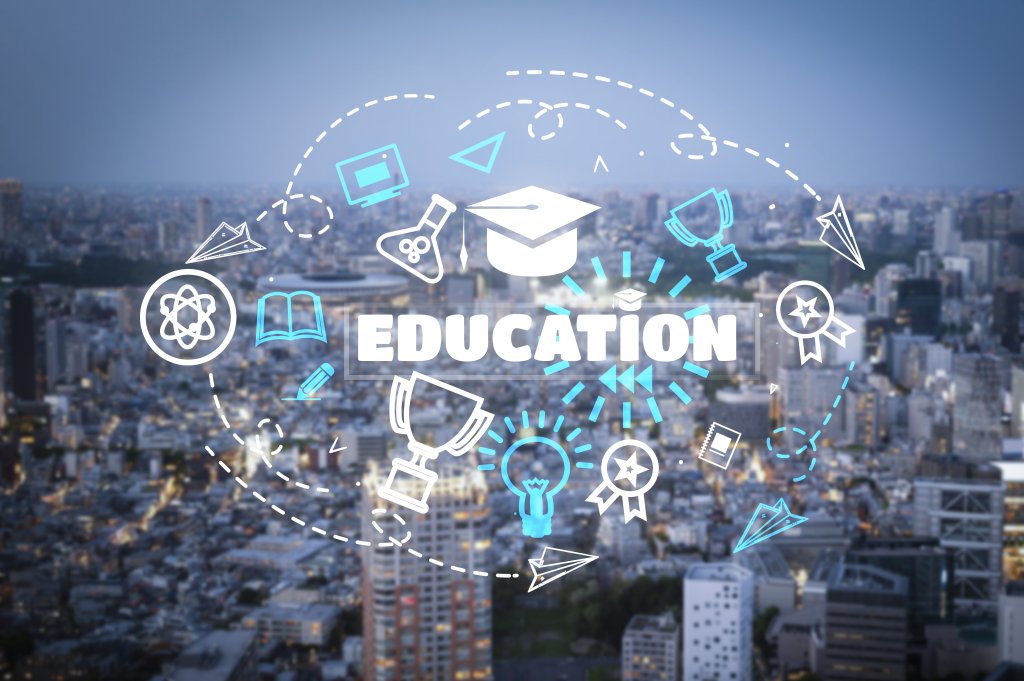 Conceptual graphic overlaying the word EDUCATION and academic icons (graduation cap, trophies, atom) onto a blurred urban city skyline.